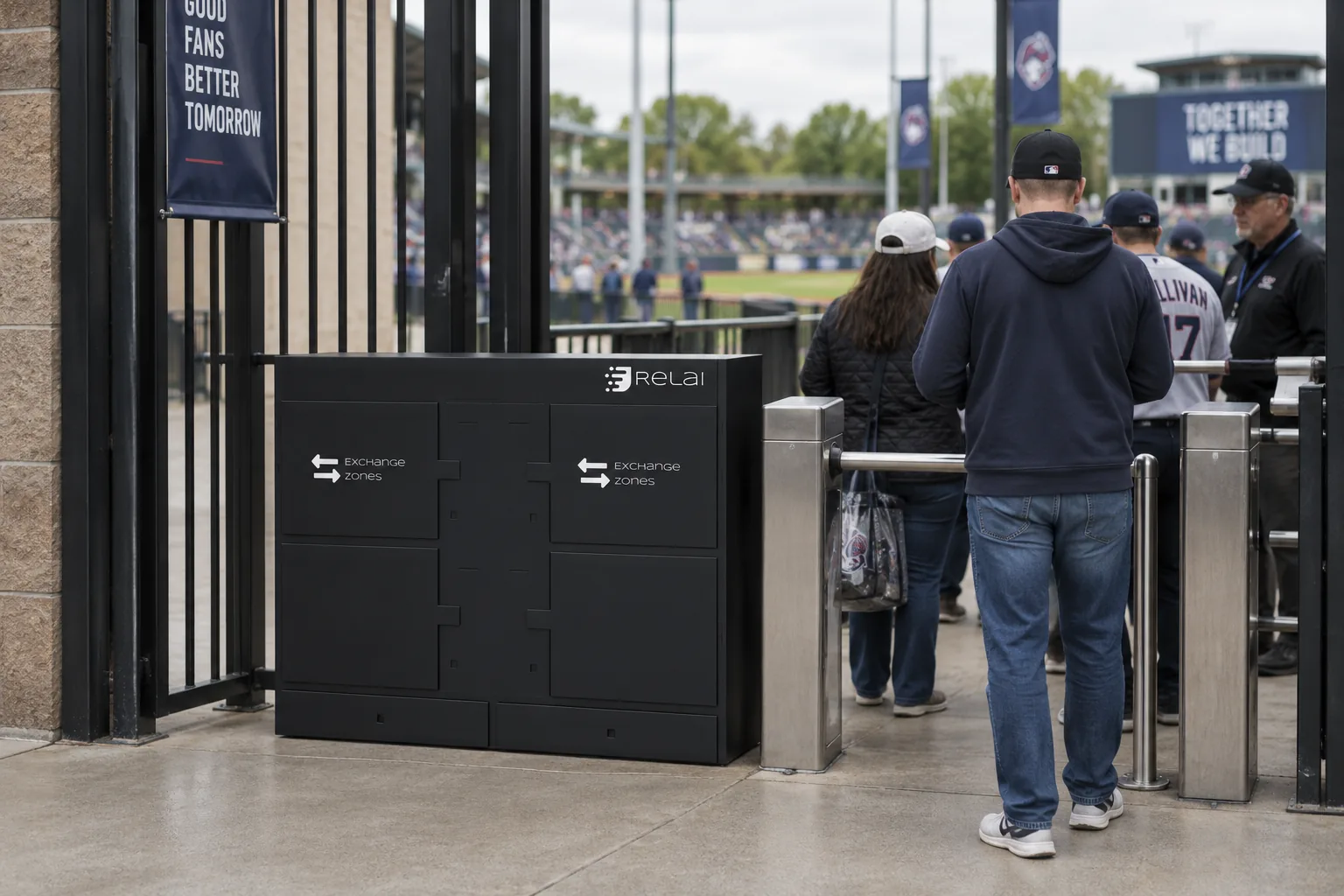 Design concept: a four compartment Exchange Zone tower in black, beside the turnstiles at a ticket entry.